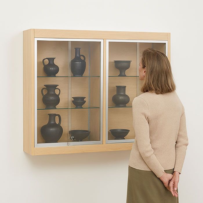 Wall Mounted display case displaying artifacts at eye level.
