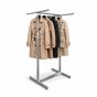 Retail clothing rack with women's trench coats displayed on adjustable 4-way garment rack