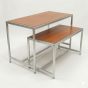 Retail nesting display table set with steel frames and dark cherry wood laminate tops, viewed from a left 3/4 angle