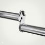 A detailed view of the polished chrome joint assembly of a connecting rail for a double bar H-rack, highlighting the clamp and tube connection point.