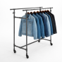 Industrial metal pipe garment rack for high-density retail merchandising.