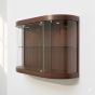 Angled view of a locking wall-mounted display case with a curved glass door in Walnut