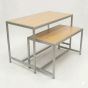 Retail nesting display table set with steel frames and light maple wood laminate tops, viewed from a left 3/4 angle