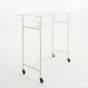 White industrial pipe double clothes rack with adjustable rails for boutique apparel display.