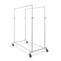 White double rail pipeline clothing rack with heavy duty casters for clothing retail display.